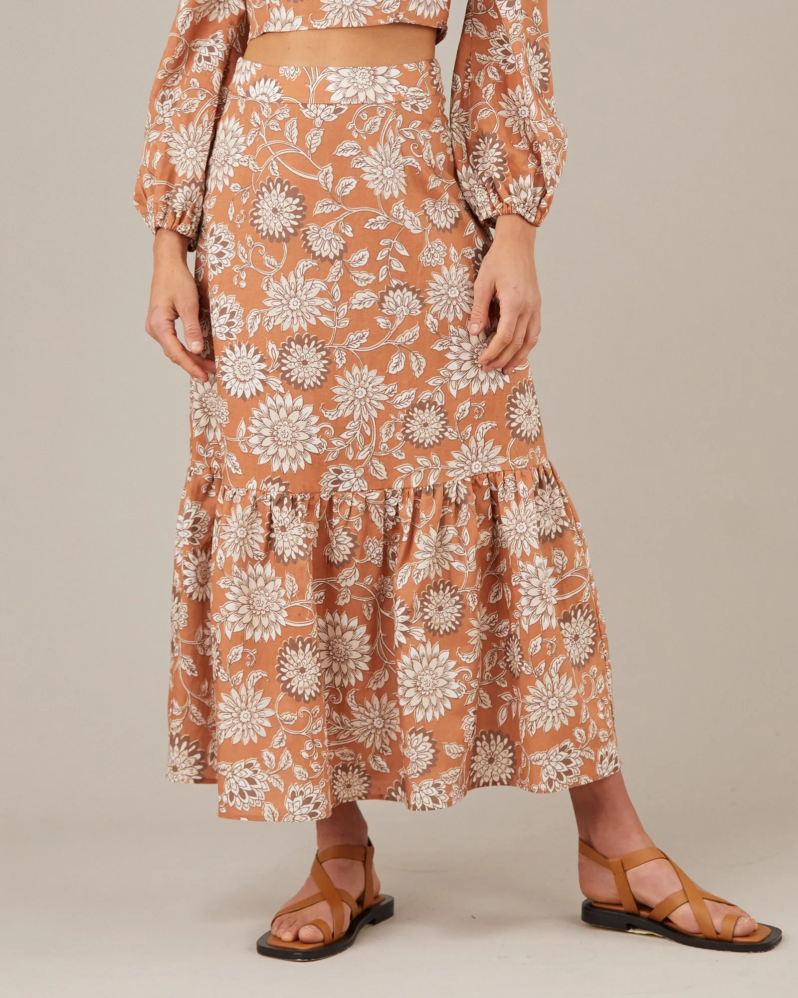 Sure! To optimize the title for an e-commerce product like a Folklore Skirt, its important to include descriptive modifiers that highlight the products unique features and appeal. Heres a suggestion:

Bohemian-Style Floral Folklore Maxi Skirt with Adjustable Waistband

This title uses modifiers such as Bohemian-Style, Floral, Maxi, and Adjustable Waistband to provide potential buyers with a clear and enticing description of the product.